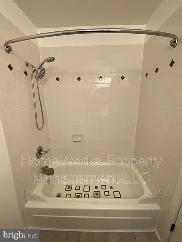 a bathroom with a bath tub