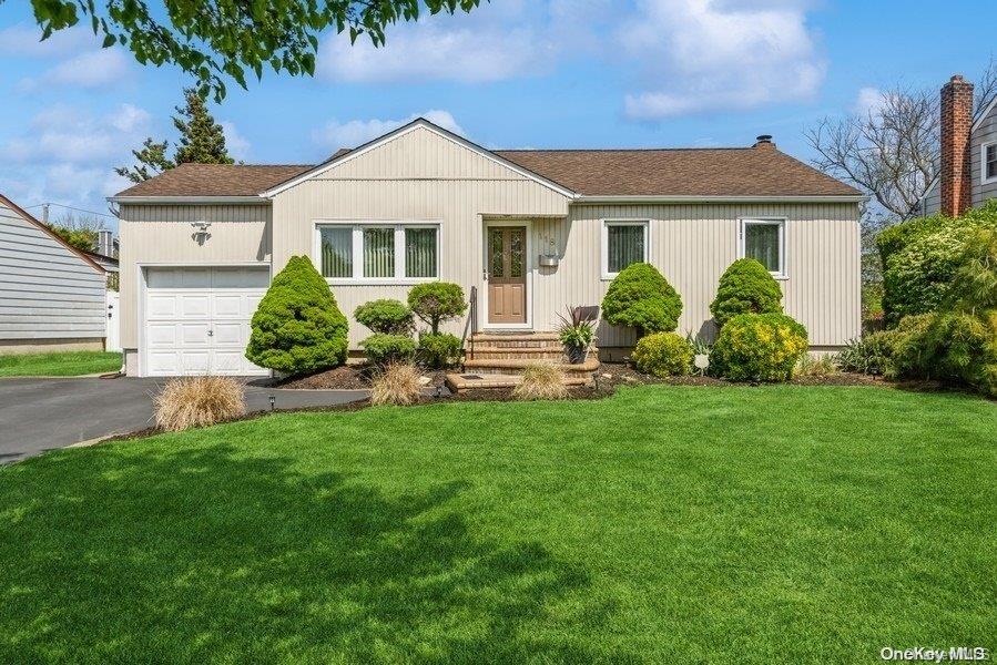 118 Knickerbocker Road West Plainview, NY 11803 - Photo 1 of 1 a front view of a house with a yard and outdoor seating