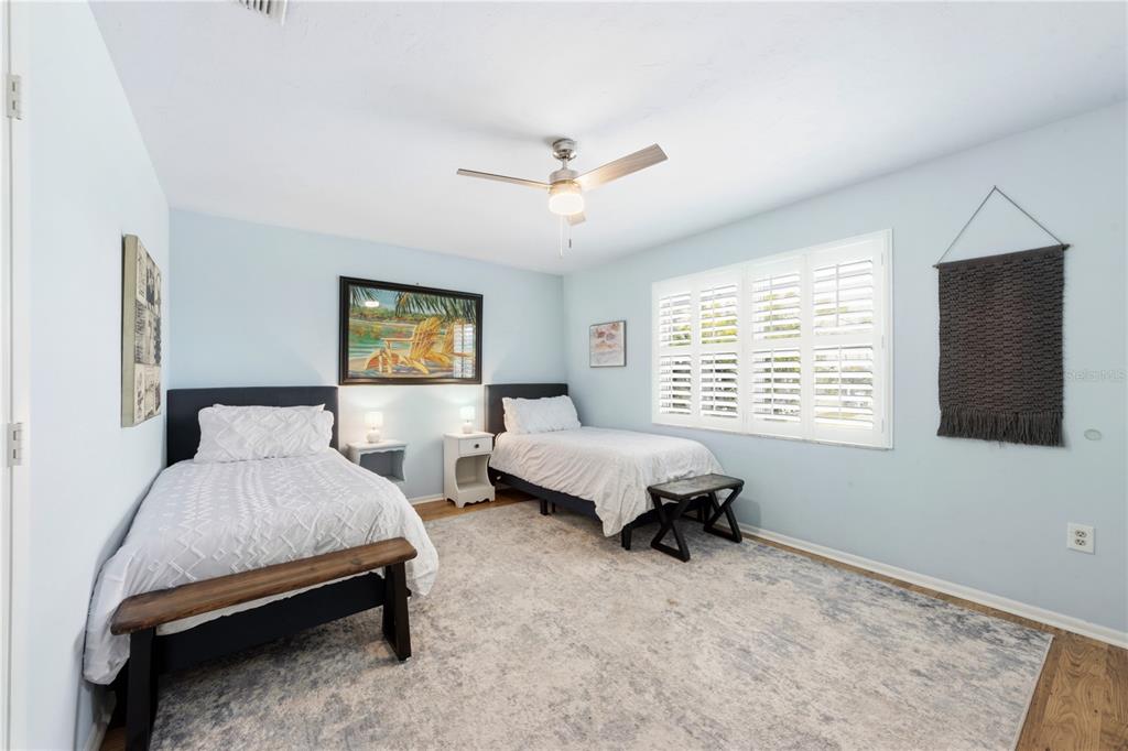 417 Poinsettia Road Anna Maria, FL 34216 - Photo 17 of 34 a bedroom with a bed and a window