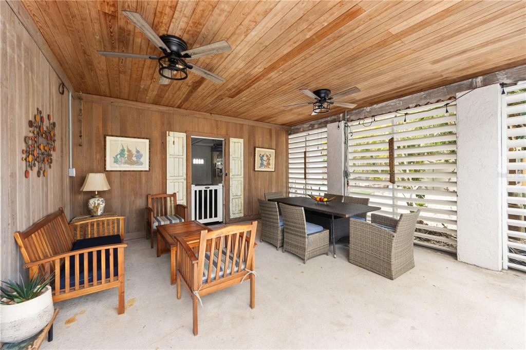 417 Poinsettia Road Anna Maria, FL 34216 - Photo 23 of 34 a living room with furniture and a window