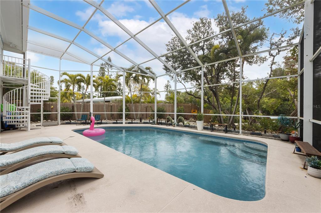 417 Poinsettia Road Anna Maria, FL 34216 - Photo 25 of 34 a view of a swimming pool with a patio