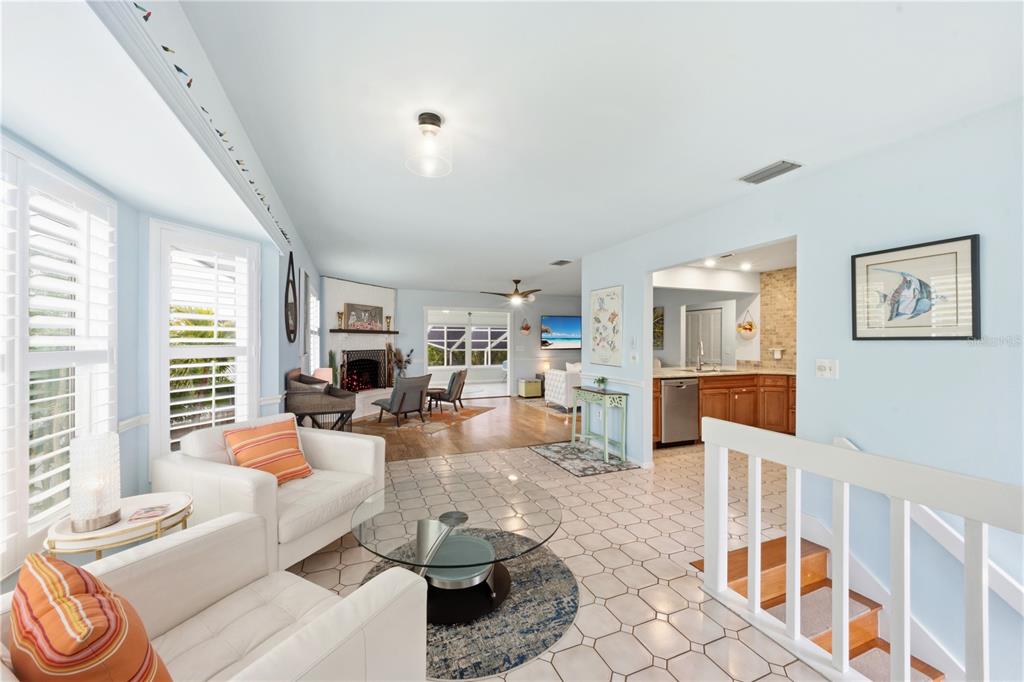 417 Poinsettia Road Anna Maria, FL 34216 - Photo 5 of 34 a living room with fireplace furniture and a large window