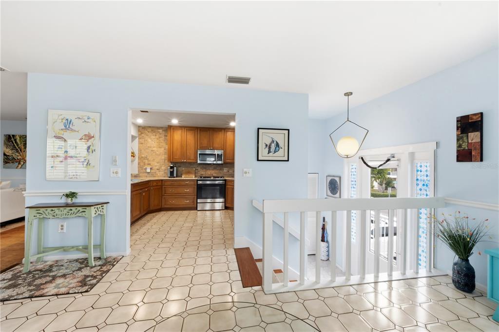 417 Poinsettia Road Anna Maria, FL 34216 - Photo 6 of 34 a living room with furniture and wooden floor
