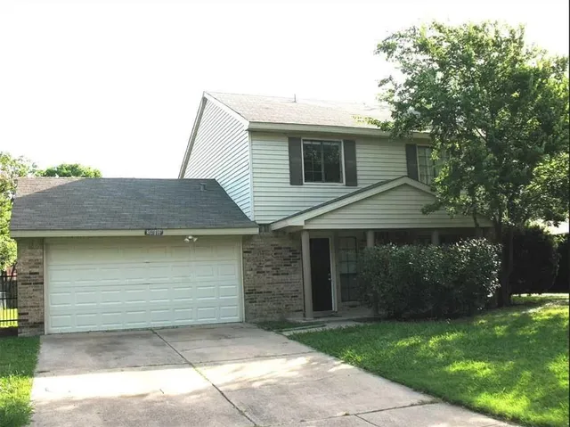 a front view of a house with a garage