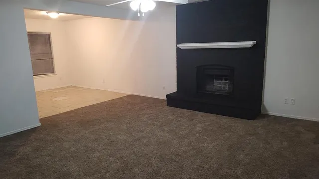 an empty room with a fireplace