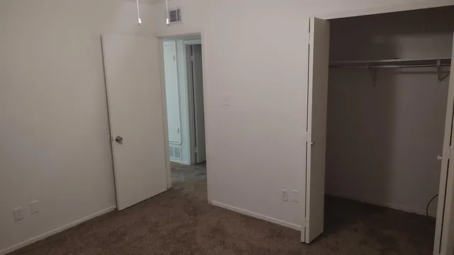an empty room with closet