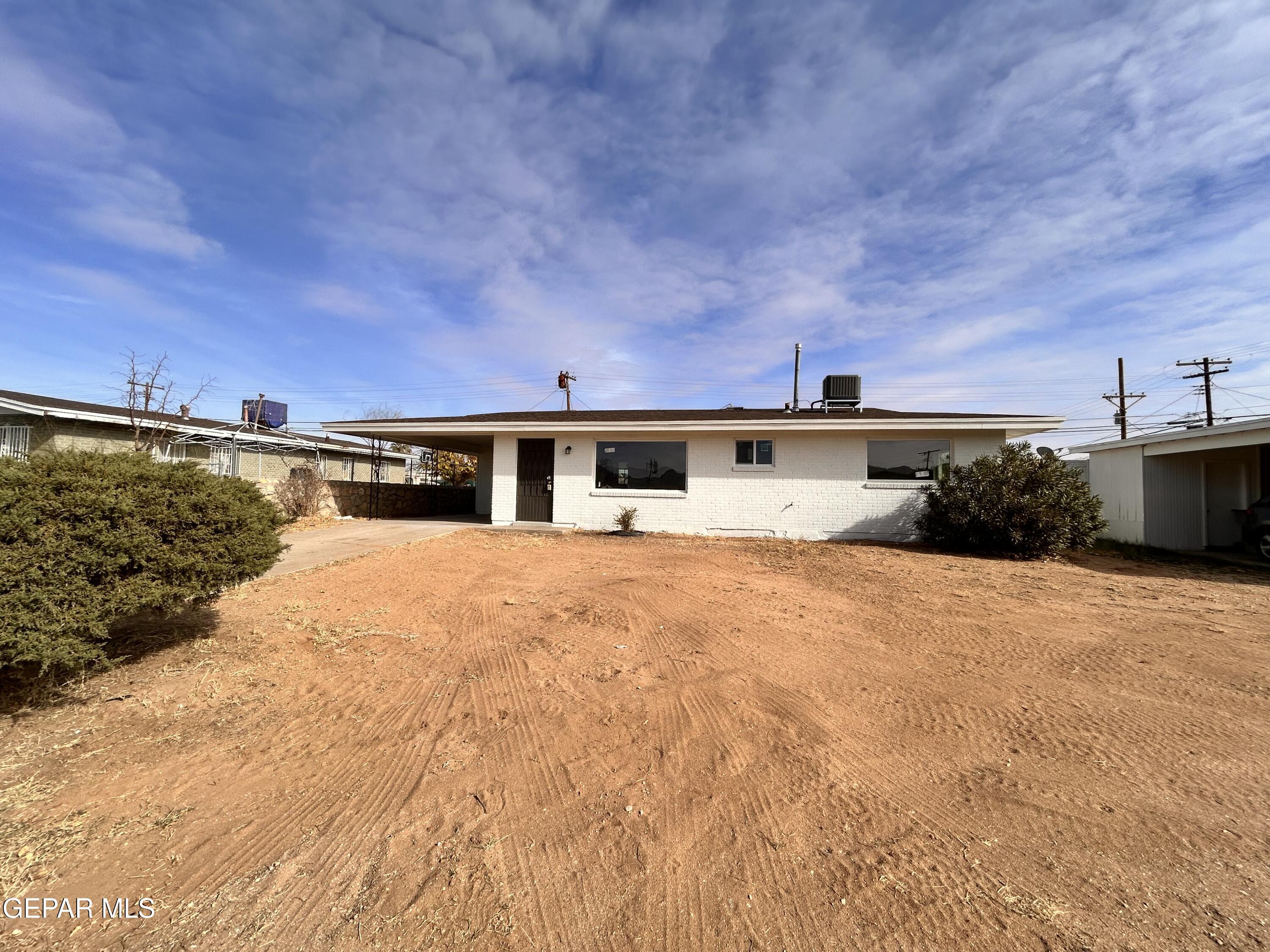 9104 Raleigh Drive El Paso, TX 79924 - Photo 2 of 20 a front view of a house with a yard