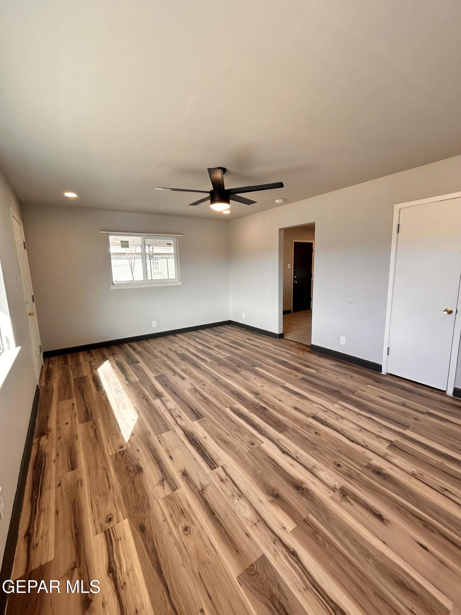 9104 Raleigh Drive El Paso, TX 79924 - Photo 6 of 20 a view of empty room with wooden floor