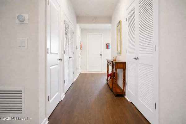 a view of a livingroom with furniture and hardwood floor