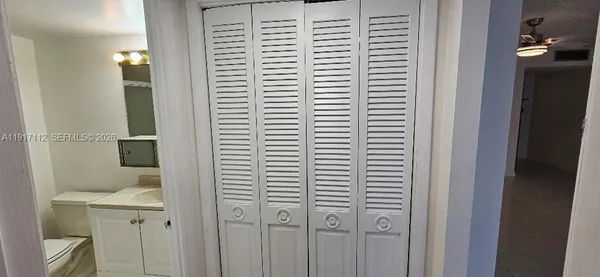 a view of a tall building and a big yard