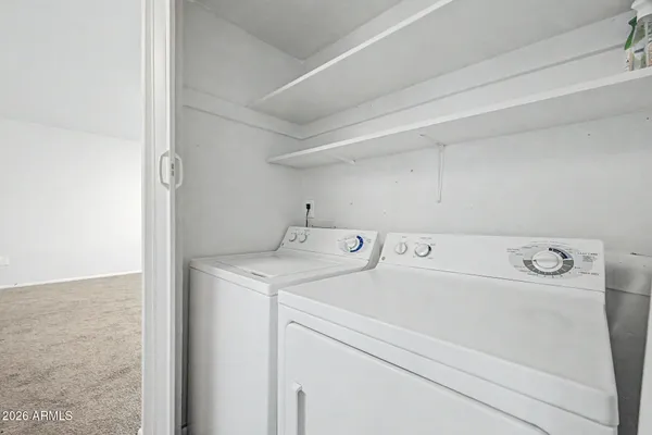a utility room with dryer and washer