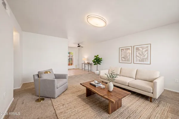 a living room with furniture and a rug