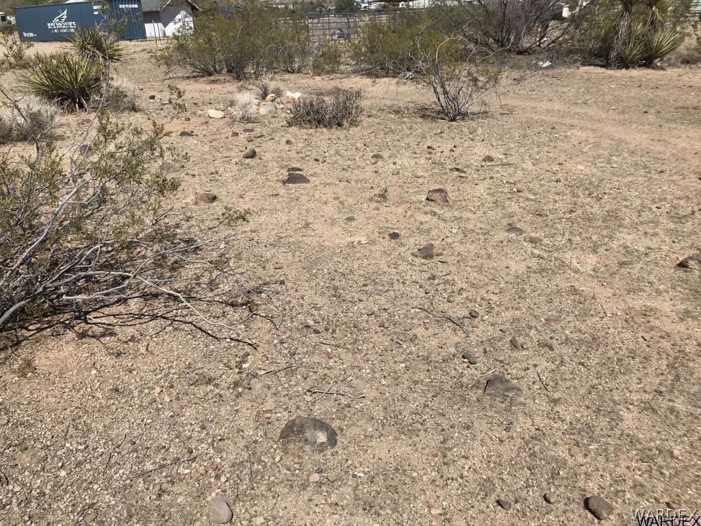3123 West Rancho Road Golden Valley, AZ 86413 - Photo 8 of 10 a view of a dry yard covered with snow