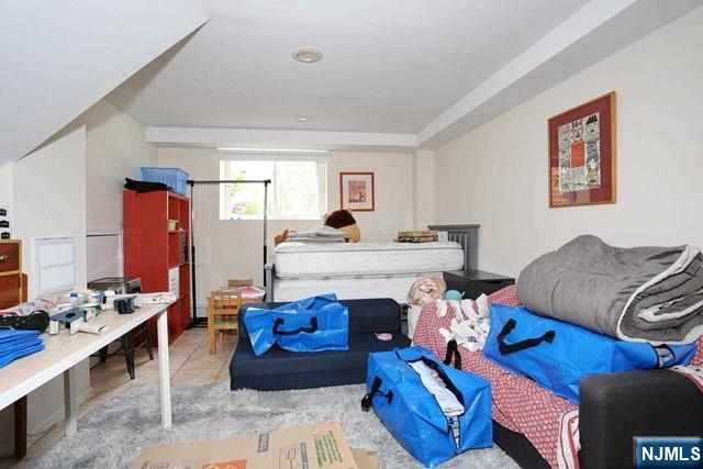 84 12th Street Cresskill, NJ 07626 - Photo 35 of 45 a living room with furniture and a couch