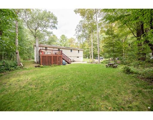 88 Beachview Road Lunenburg, MA 01462 - Photo 17 of 17 a view of a backyard with a small cabin