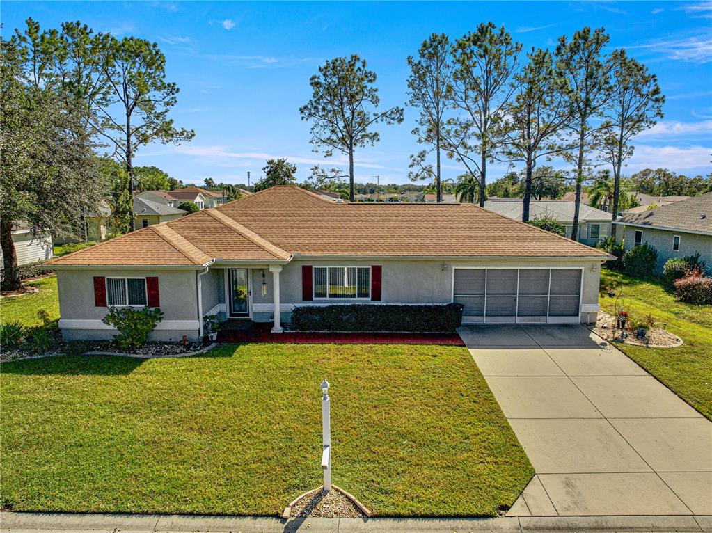 8475 Southeast 137th Loop Summerfield, FL 34491 - Photo 1 of 75 a view of house with garden space and swimming pool