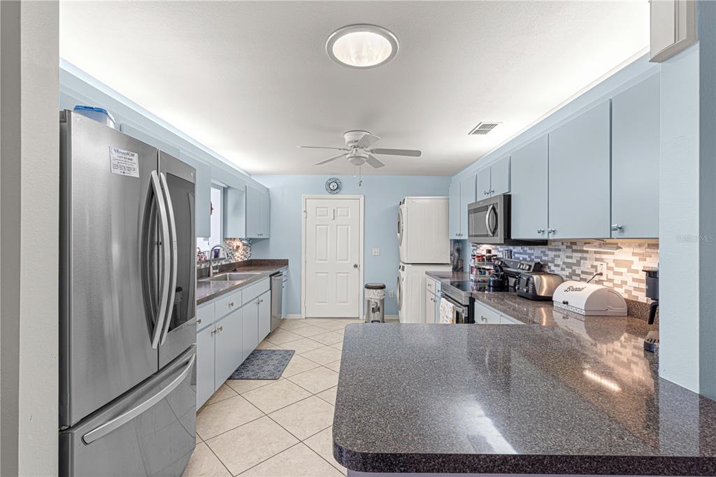 8475 Southeast 137th Loop Summerfield, FL 34491 - Photo 20 of 75 a large kitchen with cabinets