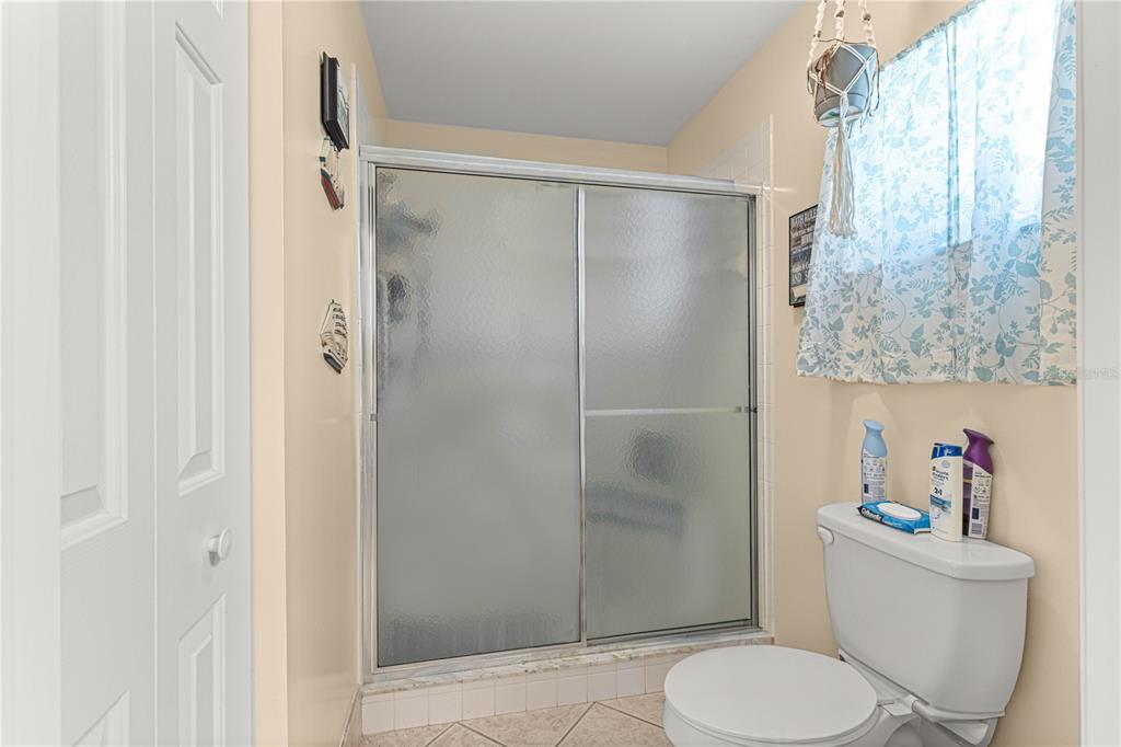 8475 Southeast 137th Loop Summerfield, FL 34491 - Photo 33 of 75 a bathroom with a toilet and a shower