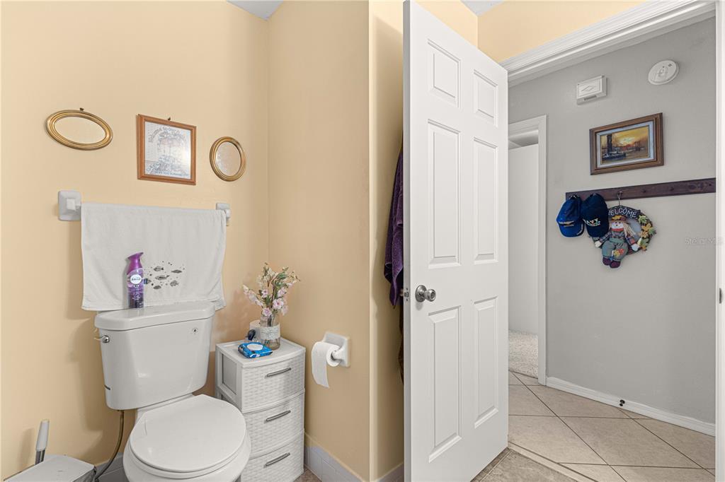 8475 Southeast 137th Loop Summerfield, FL 34491 - Photo 34 of 75 a white toilet sitting next to a bathroom sink