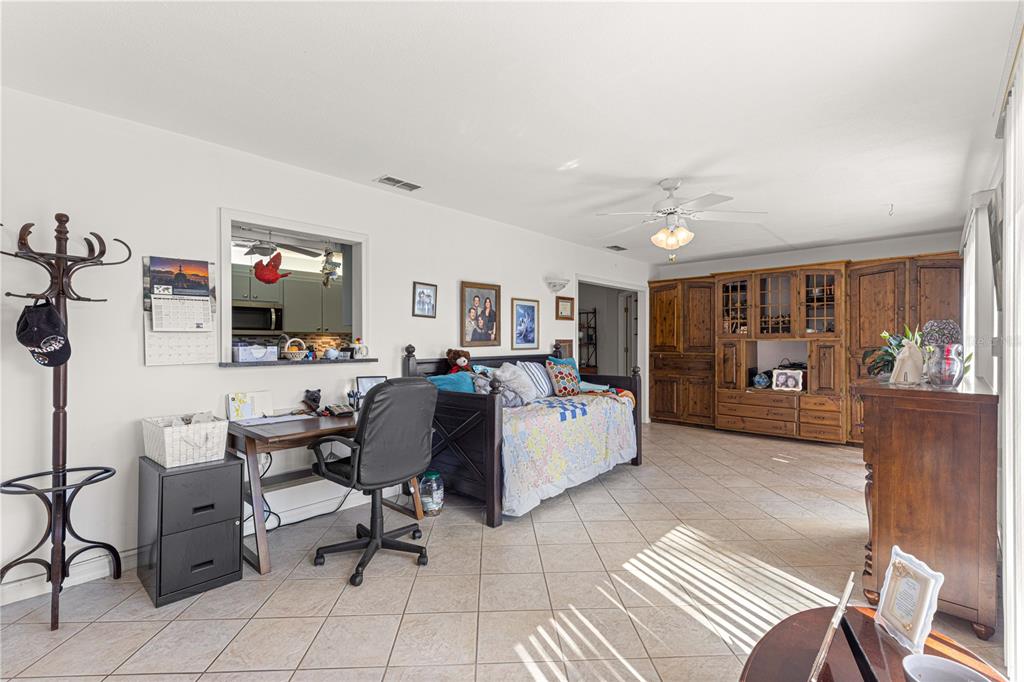 8475 Southeast 137th Loop Summerfield, FL 34491 - Photo 39 of 75 a living room with furniture and a flat screen tv