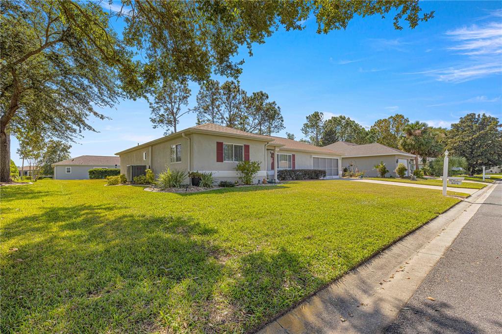 8475 Southeast 137th Loop Summerfield, FL 34491 - Photo 40 of 75 a view of house with a swimming pool
