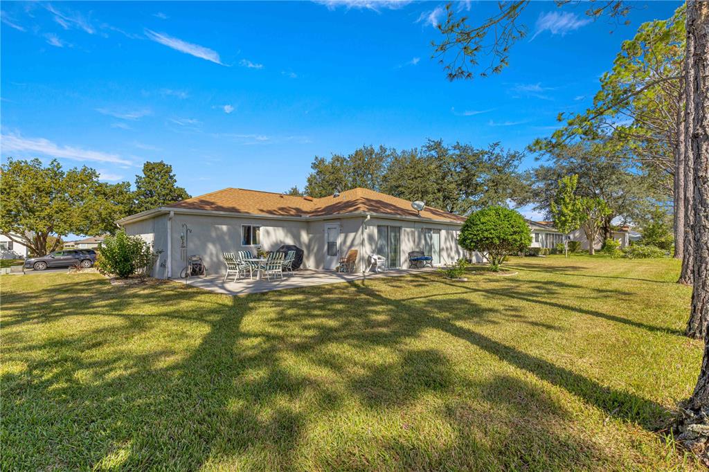 8475 Southeast 137th Loop Summerfield, FL 34491 - Photo 45 of 75 a view of a house with a big yard