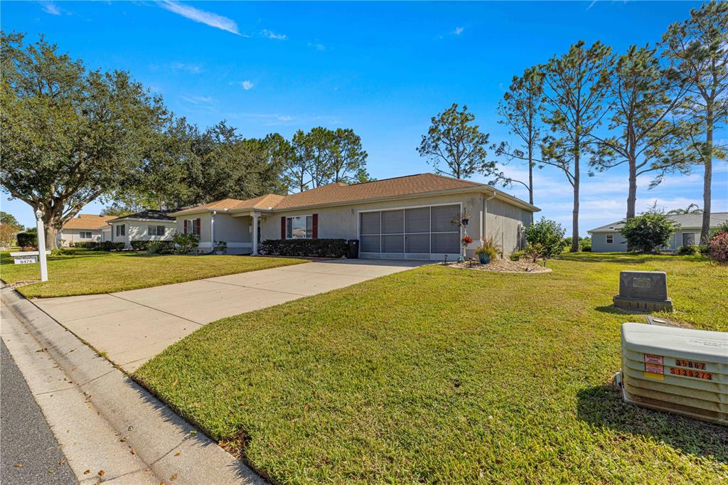 8475 Southeast 137th Loop Summerfield, FL 34491 - Photo 48 of 75 a view of a house with swimming pool and sitting area