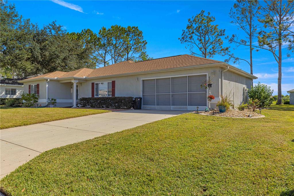 8475 Southeast 137th Loop Summerfield, FL 34491 - Photo 49 of 75 a front view of a house with a yard