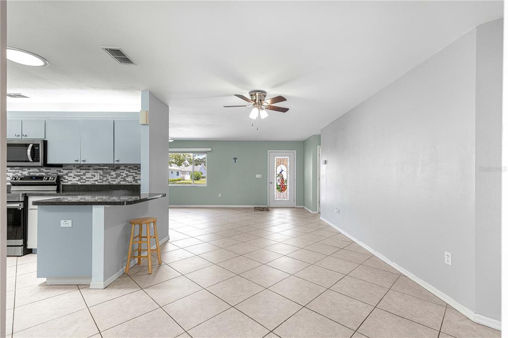 8475 Southeast 137th Loop Summerfield, FL 34491 - Photo 6 of 75 a view of a kitchen with a sink and cabinets