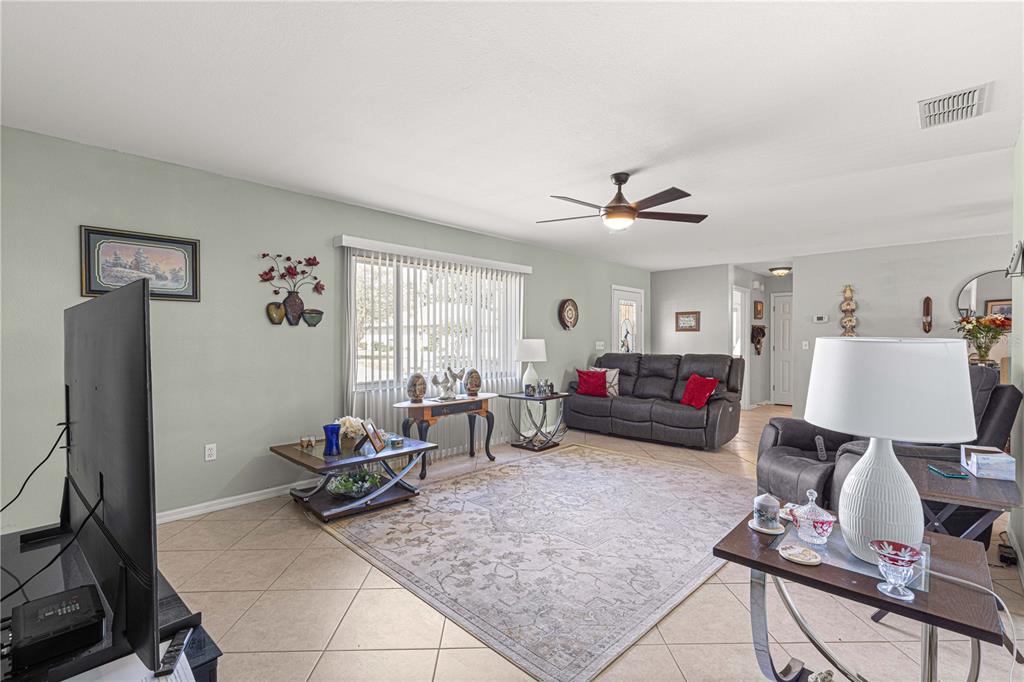 8475 Southeast 137th Loop Summerfield, FL 34491 - Photo 8 of 75 a living room with furniture and a window