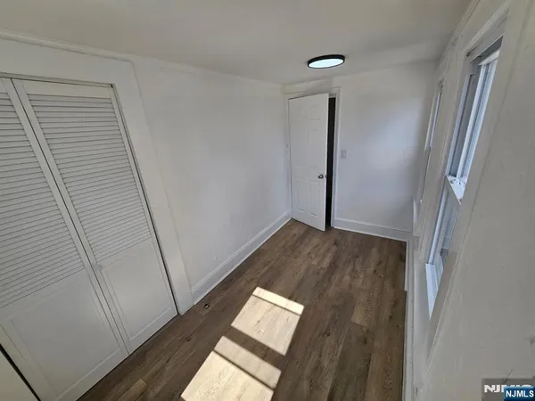 a view of front door with wooden floor