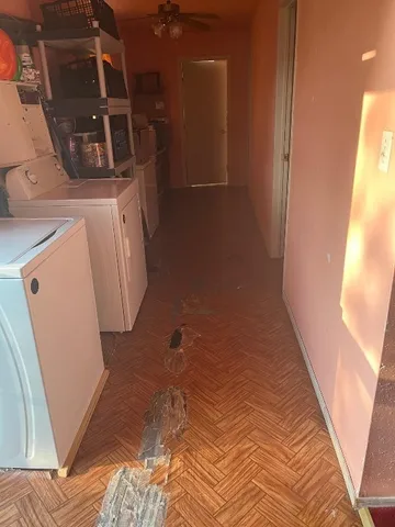 a view of a kitchen with kitchen island stainless steel appliances refrigerator stove microwave and cabinets