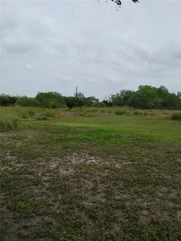 a view of a lake with a big yard