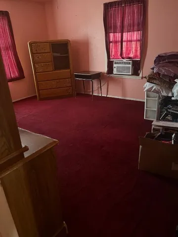 a view of an empty room with a flat screen tv