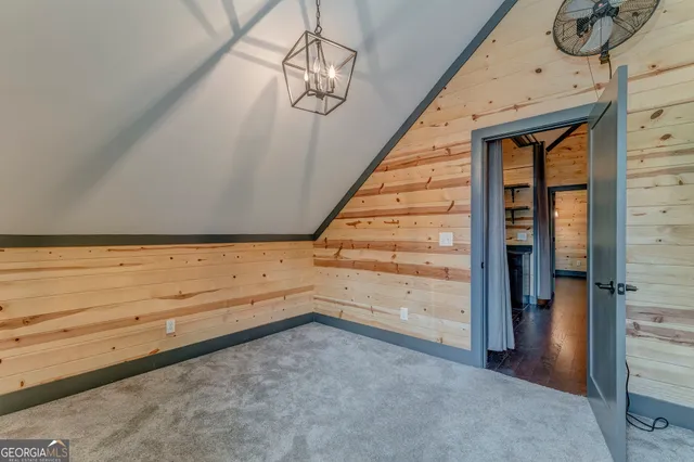 a bathroom with a granite countertop sink a toilet and bathtub