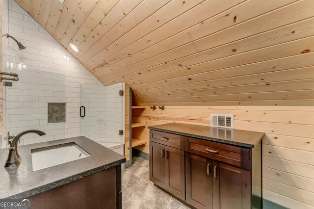 a utility room with a sink dryer and washer
