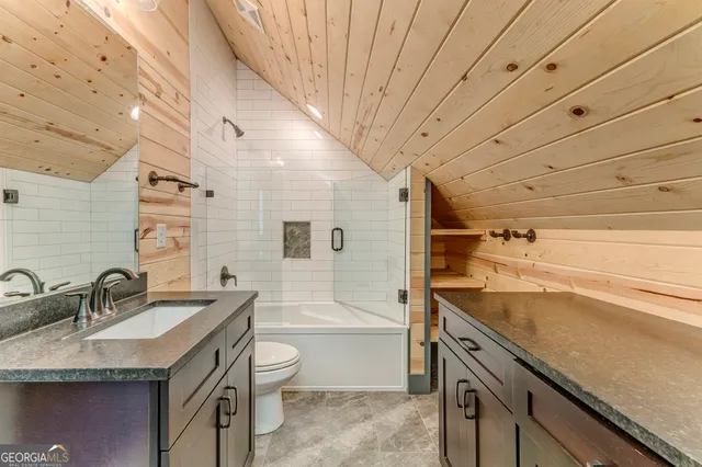 a view of an empty room and wooden floor