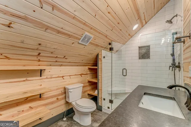 a view of a balcony with wooden floor