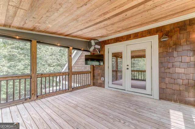 a view of an empty room with furniture