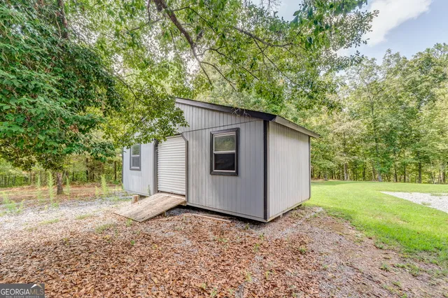 a view of a field with an trees
