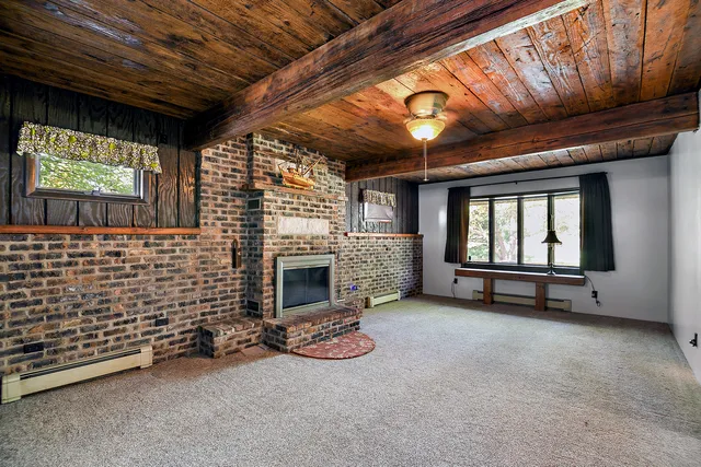 a view of an empty room with a fireplace