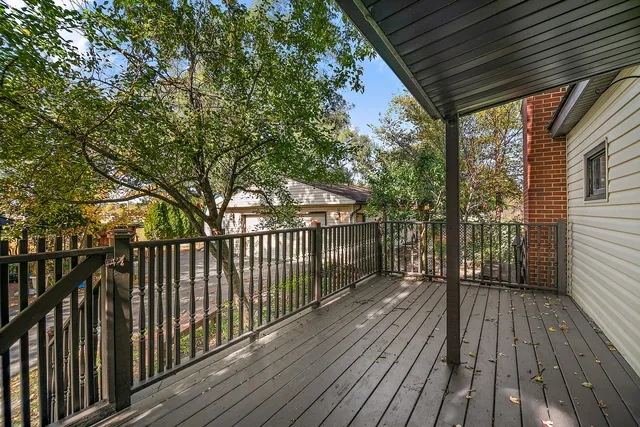a view of balcony with wooden floor