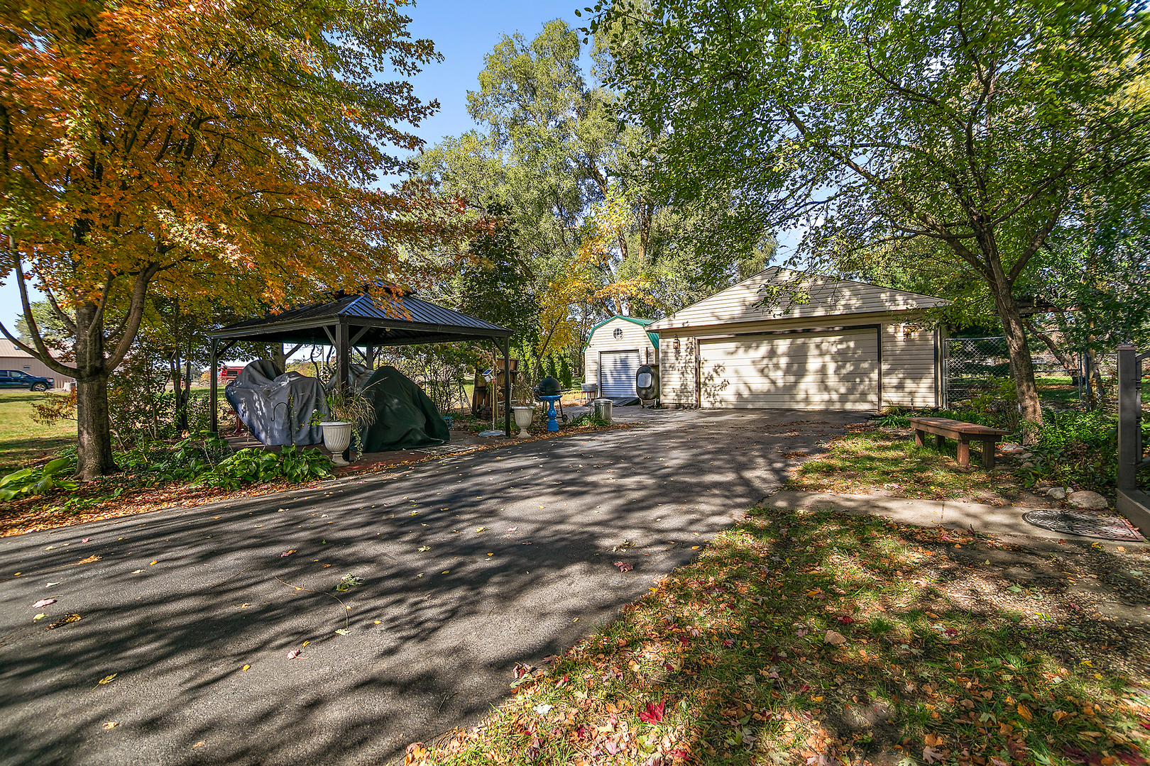 201 East Vanderkarr Road St. Anne, IL 60964 - Photo 23 of 32 a front view of a house with garden