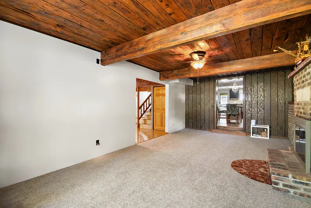 a view of a room with wooden floor