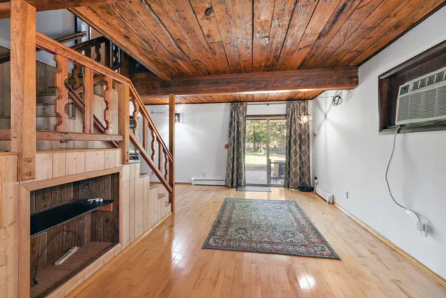 a view of an entryway with wooden floor