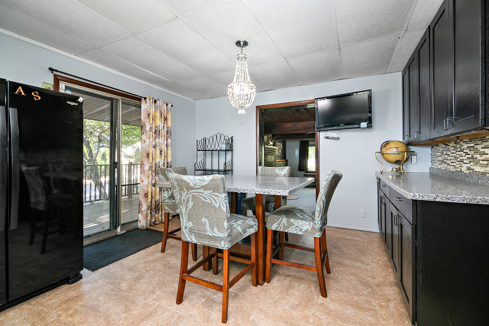 201 East Vanderkarr Road St. Anne, IL 60964 - Photo 7 of 32 a dining room with furniture a chandelier and window