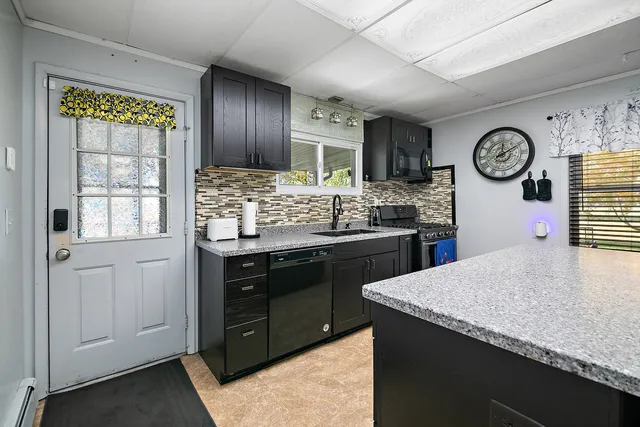 a kitchen with a stove and a refrigerator