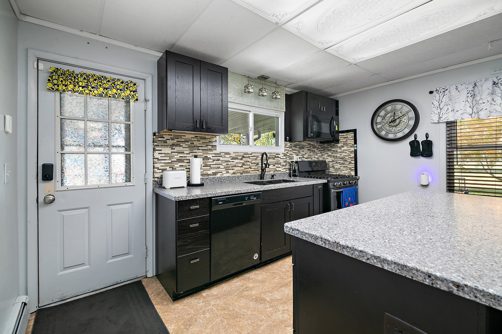 201 East Vanderkarr Road St. Anne, IL 60964 - Photo 10 of 32 a kitchen with a stove and a refrigerator
