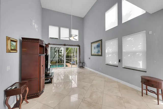 a kitchen with stainless steel appliances white cabinets and a refrigerator
