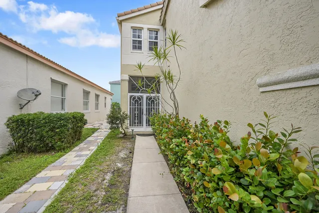 a kitchen with stainless steel appliances white cabinets and a refrigerator